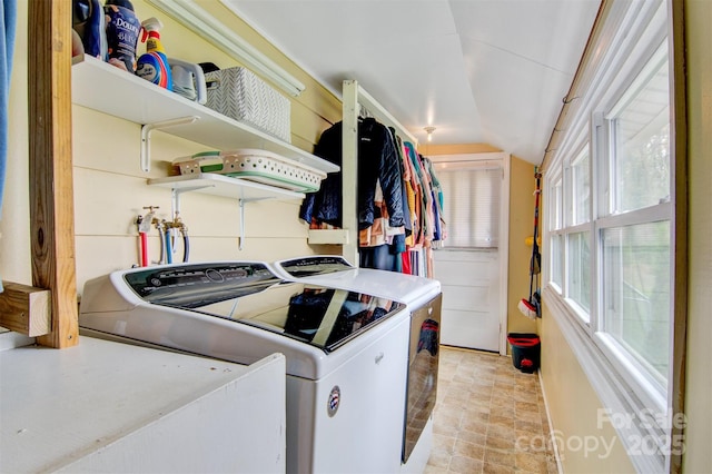 clothes washing area with separate washer and dryer and laundry area