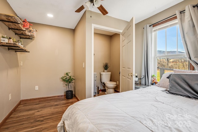 bedroom featuring wood finished floors, ensuite bath, baseboards, ceiling fan, and recessed lighting