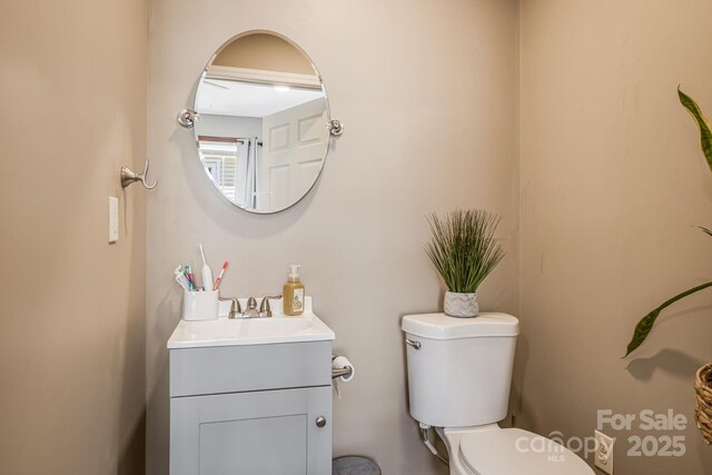 half bath with toilet and vanity