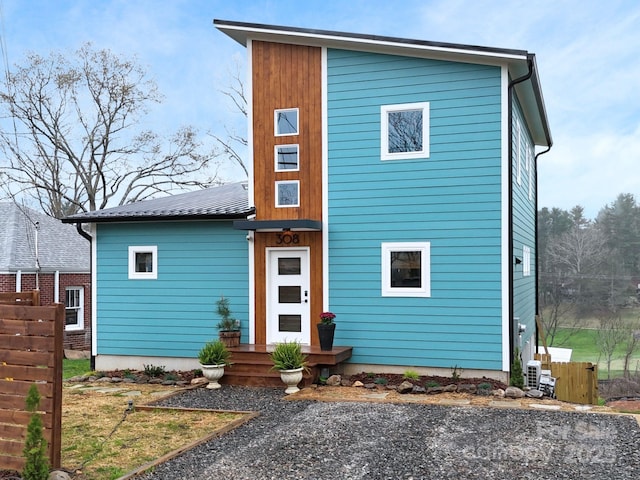 view of front of house featuring fence