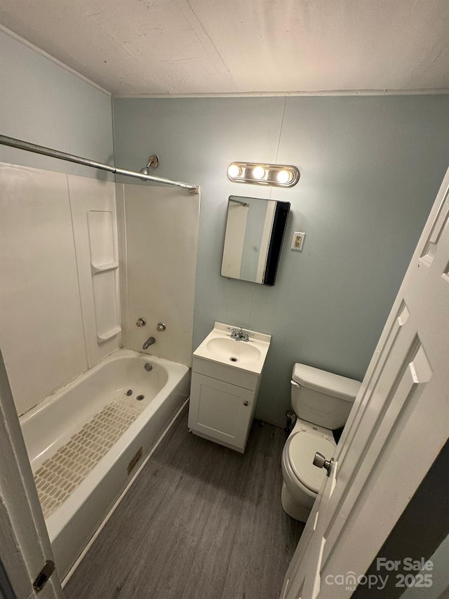 4510 Wildwood Ave, Charlotte, NC 28208 - bathroom with toilet, vanity, tub / shower combination, and wood finished floors