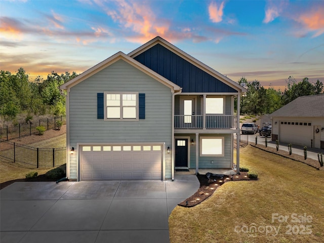 10270 Lakeshore Dr, Lancaster, SC 29720 - view of front of property featuring a garage, fence, a balcony, concrete driveway, and a yard
