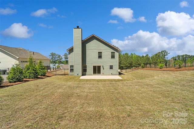 10270 Lakeshore Dr, Lancaster, SC 29720 - rear view of house with a fenced backyard, a chimney, and a patio area