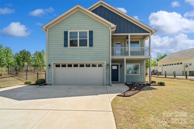 10270 Lakeshore Dr, Lancaster, SC 29720 - view of front of house with board and batten siding, driveway, fence, a balcony, and an attached garage