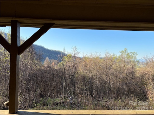 property view of mountains featuring a view of trees