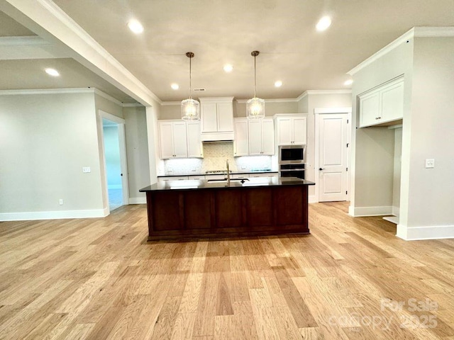 kitchen featuring baseboards, decorative backsplash, stainless steel oven, and dark countertops