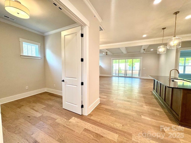 interior space featuring visible vents, recessed lighting, baseboards, and crown molding