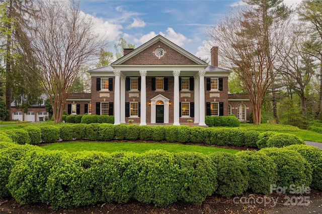 31 Busbee Rd, Asheville, NC 28803 - greek revival house with a porch, a chimney, and brick siding