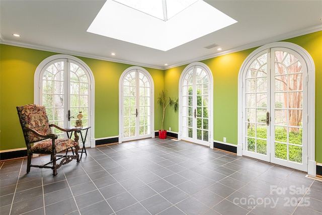 31 Busbee Rd, Asheville, NC 28803 - unfurnished room featuring a skylight, baseboards, ornamental molding, and recessed lighting