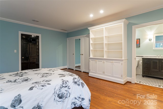 31 Busbee Rd, Asheville, NC 28803 - bedroom with ensuite bath, baseboards, crown molding, and wood finished floors