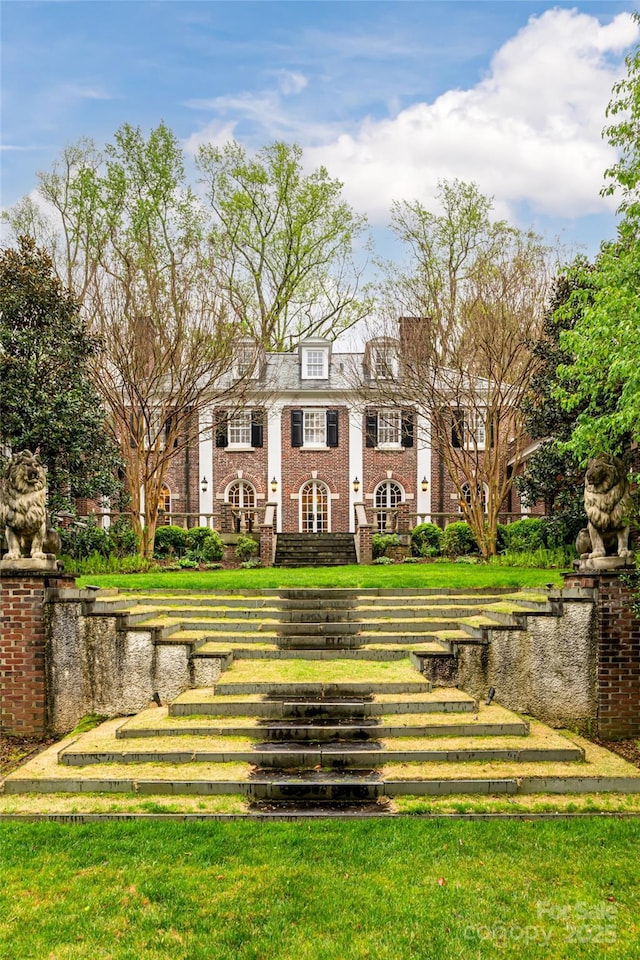 31 Busbee Rd, Asheville, NC 28803 - exterior space featuring a front yard and brick siding