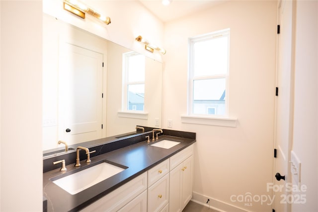 full bath with double vanity and a sink