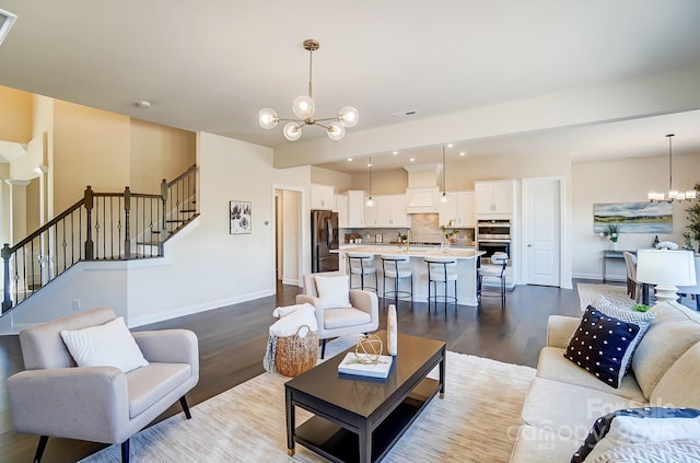 11144 Limehurst Pl, Charlotte, NC 28278 - living area with a chandelier, dark wood-style flooring, stairway, and recessed lighting