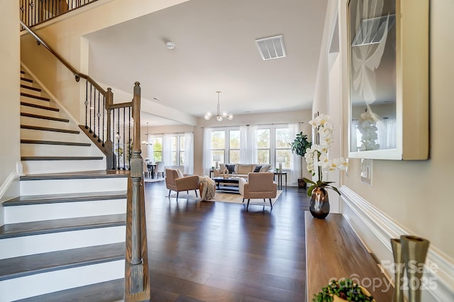 11144 Limehurst Pl, Charlotte, NC 28278 - living area with a chandelier, stairs, and dark wood-type flooring
