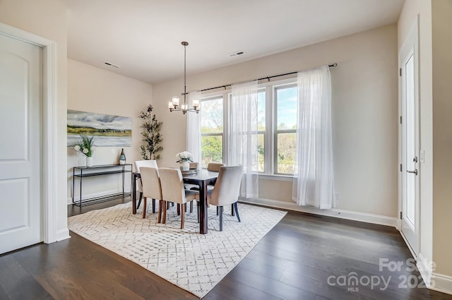 11144 Limehurst Pl, Charlotte, NC 28278 - dining room featuring dark wood-style flooring and a chandelier