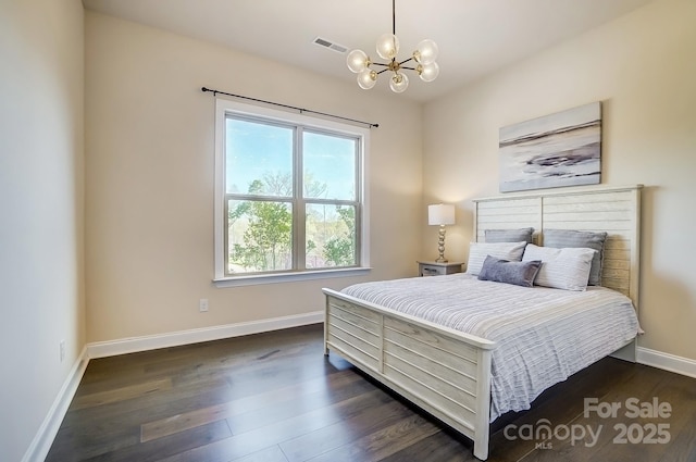 11144 Limehurst Pl, Charlotte, NC 28278 - bedroom featuring a chandelier and dark wood-type flooring