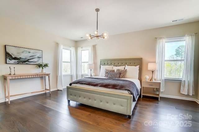11144 Limehurst Pl, Charlotte, NC 28278 - bedroom with a chandelier and dark wood-style floors