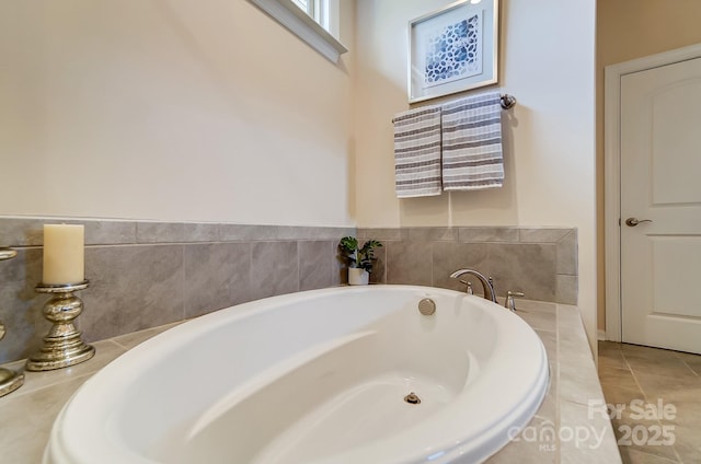 11144 Limehurst Pl, Charlotte, NC 28278 - bathroom featuring a garden tub and tile patterned flooring