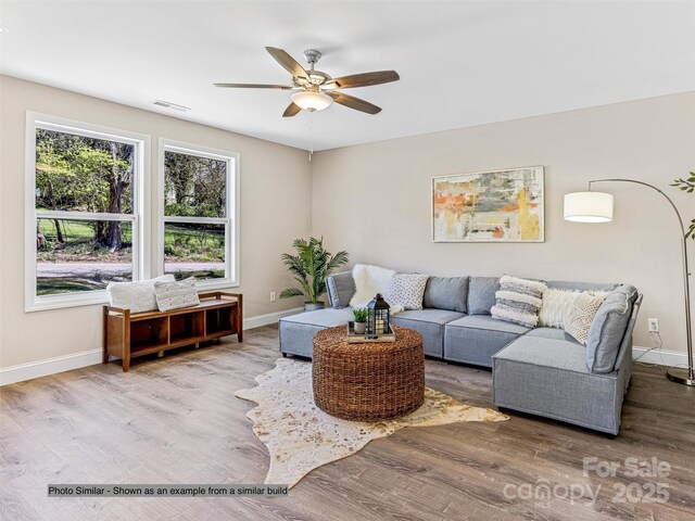 15 Border St, Black Mountain, NC 28711 - living room with baseboards, a ceiling fan, and wood finished floors