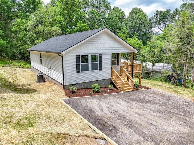15 Border St, Black Mountain, NC 28711 - view of front of property with crawl space, stairway, a shingled roof, a front yard, and a wooden deck