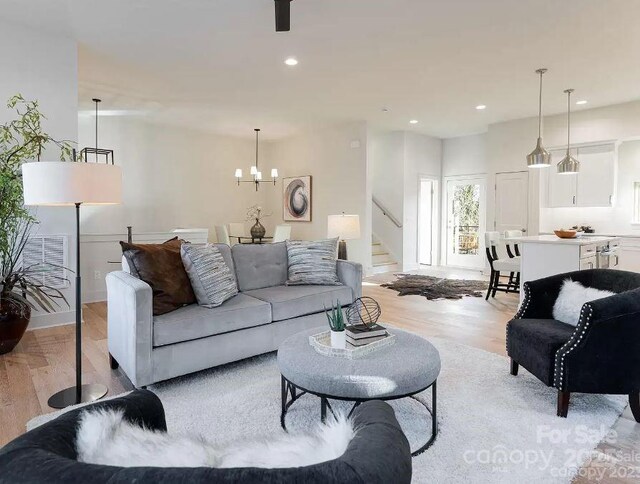 15 Macallan Ln Unit 21, Asheville, NC 28805 - living area featuring an inviting chandelier, stairway, light wood finished floors, and recessed lighting