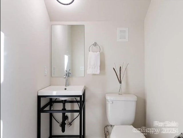 15 Macallan Ln Unit 21, Asheville, NC 28805 - half bath featuring toilet, a sink, and visible vents