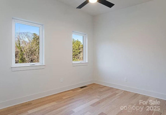 15 Macallan Ln Unit 21, Asheville, NC 28805 - spare room with baseboards, visible vents, ceiling fan, and light wood-style flooring