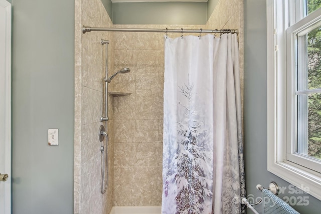 bathroom with a tile shower