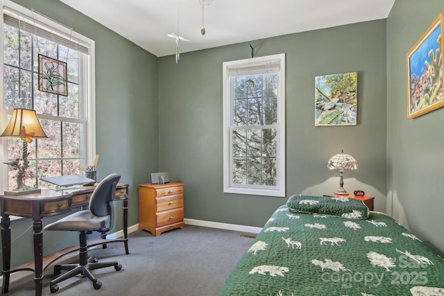 bedroom featuring baseboards, carpet flooring, and visible vents