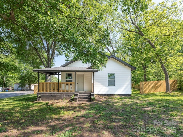 108 Graham St, Chester, SC 29706 - bungalow-style home featuring a front lawn, a porch, and fence