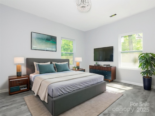 108 Graham St, Chester, SC 29706 - bedroom featuring visible vents, wood finished floors, and baseboards