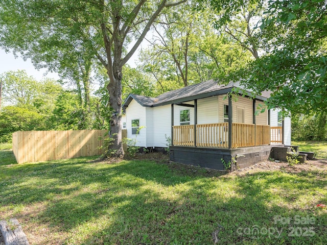 108 Graham St, Chester, SC 29706 - view of home's exterior with a porch, fence, and a lawn