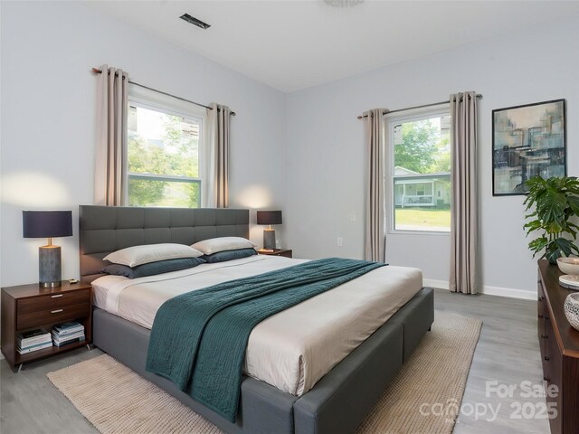 108 Graham St, Chester, SC 29706 - bedroom featuring light wood finished floors, baseboards, and multiple windows