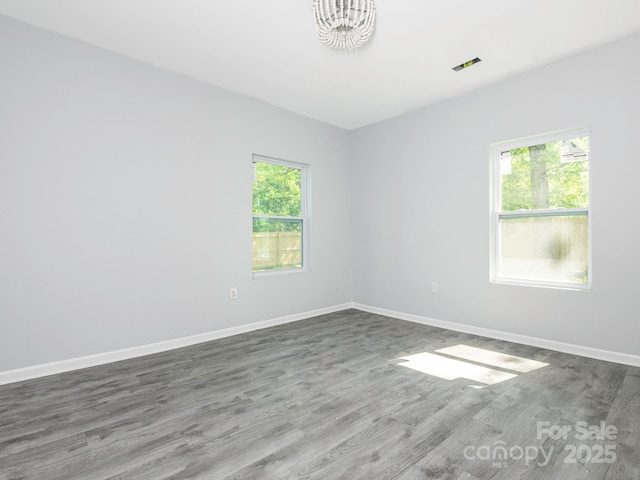 108 Graham St, Chester, SC 29706 - empty room with a chandelier, wood finished floors, and baseboards