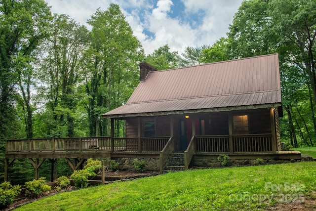 2610 Indian Grave Rd, Lenoir, NC 28645 - view of front facade with a chimney, a front yard, and metal roof