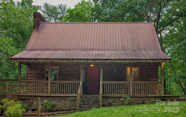 2610 Indian Grave Rd, Lenoir, NC 28645 - view of front of house with a chimney, metal roof, and a porch