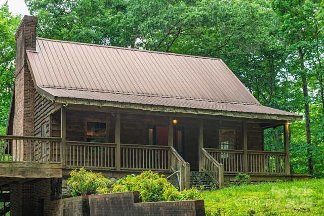 2610 Indian Grave Rd, Lenoir, NC 28645 - view of front of home with a chimney, a porch, metal roof, and stairway