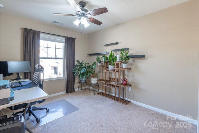 office space with baseboards, visible vents, and carpet