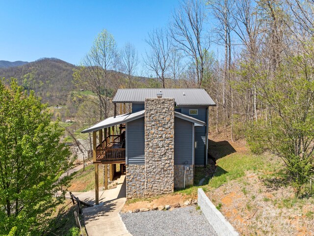 58 Country Cottage Ln, Canton, NC 28716 - view of home's exterior featuring stone siding, a mountain view, and metal roof