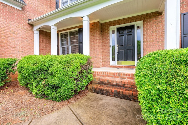 1102 High Brook Dr, Waxhaw, NC 28173 - view of exterior entry featuring a porch and brick siding