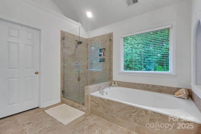 1102 High Brook Dr, Waxhaw, NC 28173 - bathroom with a shower stall, a bath, and lofted ceiling