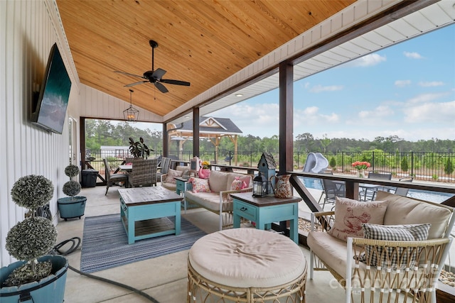 view of patio with fence, ceiling fan, and outdoor lounge area