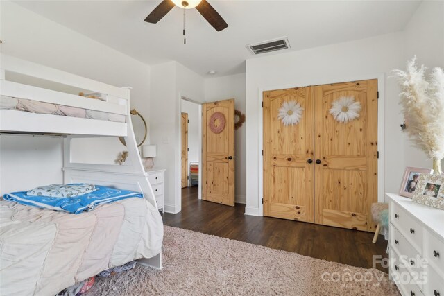 bedroom featuring visible vents, wood finished floors, and ceiling fan