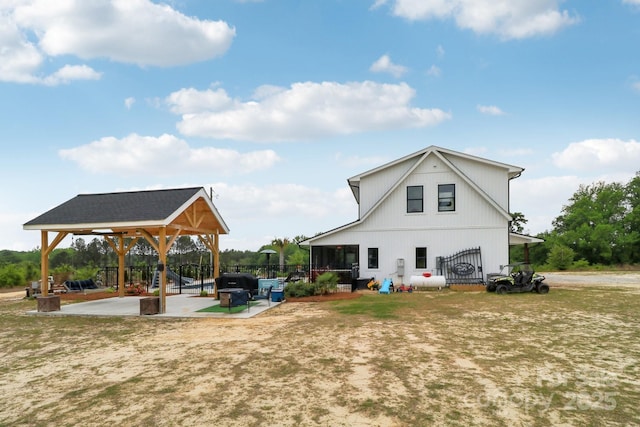 back of property with a gazebo