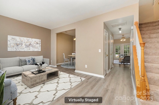 1720 Chamberside Dr, Rock Hill, SC 29730 - living room with visible vents, baseboards, wood finished floors, stairway, and french doors