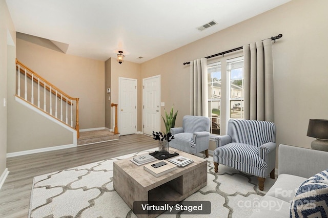 1720 Chamberside Dr, Rock Hill, SC 29730 - living area with wood finished floors, baseboards, stairway, and visible vents