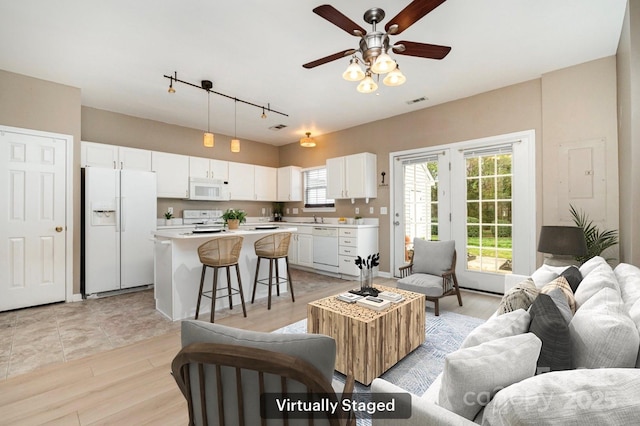 1720 Chamberside Dr, Rock Hill, SC 29730 - living room featuring a ceiling fan, track lighting, light wood-style floors, and visible vents