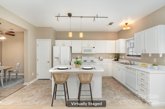 1720 Chamberside Dr, Rock Hill, SC 29730 - kitchen featuring white cabinets, visible vents, a sink, and white appliances