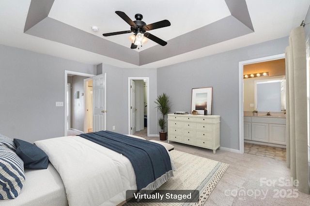 1720 Chamberside Dr, Rock Hill, SC 29730 - bedroom featuring a walk in closet, a tray ceiling, light colored carpet, baseboards, and ensuite bath