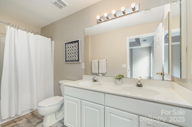 1720 Chamberside Dr, Rock Hill, SC 29730 - bathroom with double vanity, visible vents, toilet, and a sink